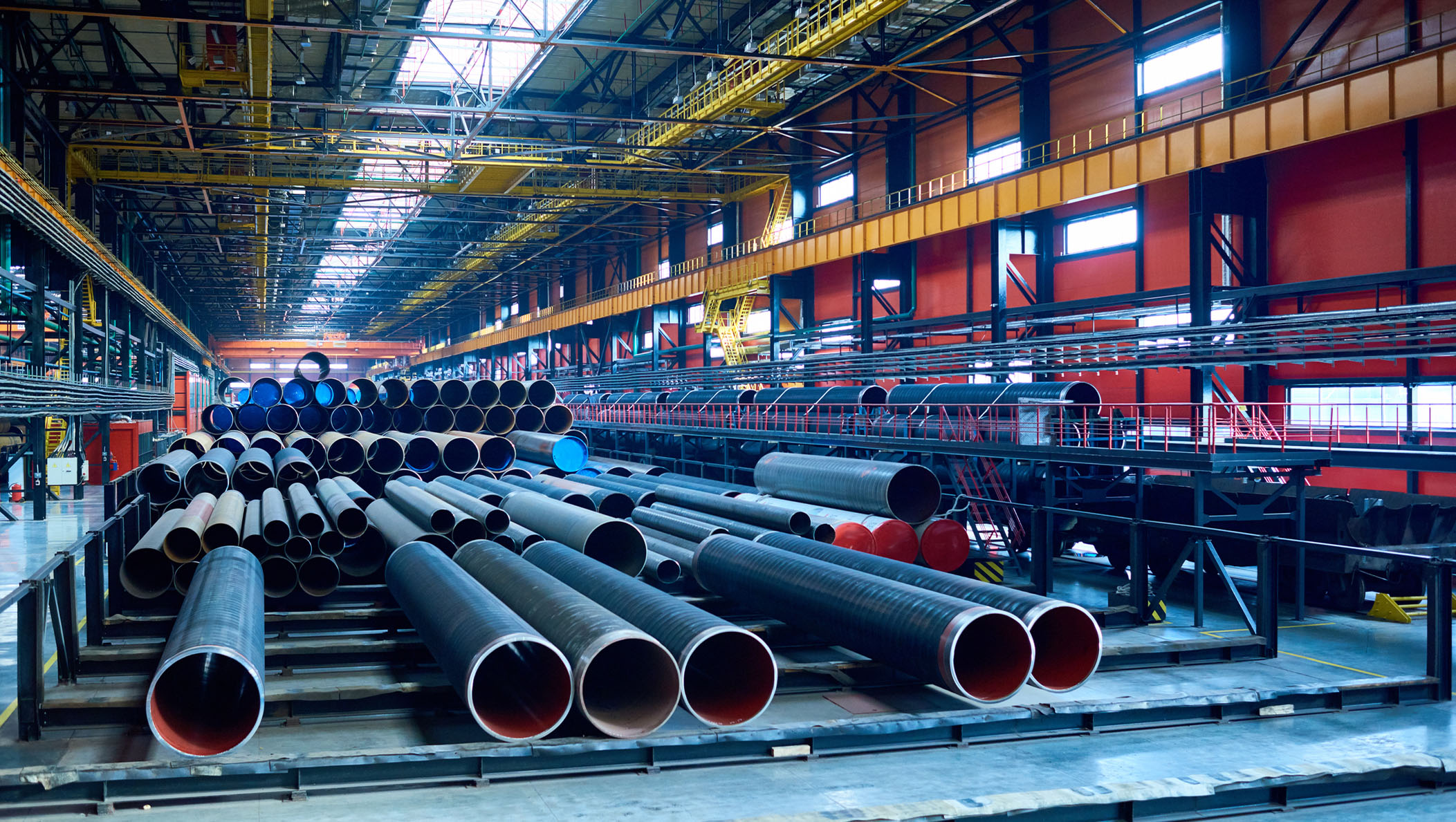 An abundance of tubes used for oil and gas industry placed in factory warehouse